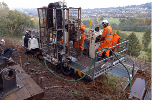 Ground investigation using a P60 slope climbing drilling rig on steep banks above the A40 Brecon Bypass.